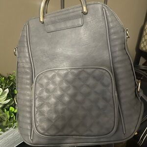 Gray Quilted Backpack with Gold Accents